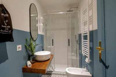 a bathroom with a sink and a shower at Daplace - Serena Apartment in Rome