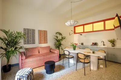 a living room with a table and a couch at Daplace - Serena Apartment in Rome