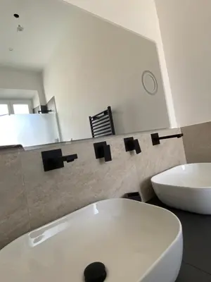 a bathroom with a white toilet and a sink at Casa Camillo in Rome