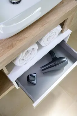 a bathroom shelf with towels and a sink at Luxury Domus- Metro Malatesta in Rome