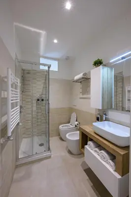 a bathroom with a shower and a toilet and a sink at Luxury Domus- Metro Malatesta in Rome
