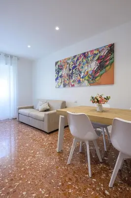a living room with a table and a couch at Luxury Domus- Metro Malatesta in Rome