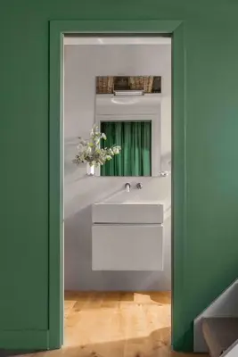 a bathroom with a sink and a mirror at Crossing Condotti in Rome