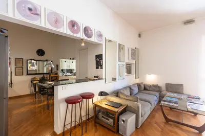 a living room with a couch and a table at Borgo Vittorio Terrace by Rental in Rome in Rome