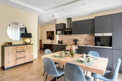 a kitchen and dining room with a table and chairs at ROMAN DREAM lll in Rome