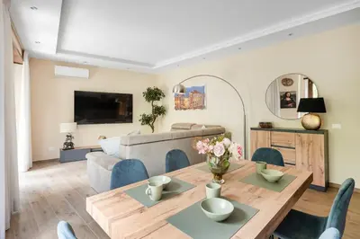 a living room with a table and a couch at ROMAN DREAM lll in Rome