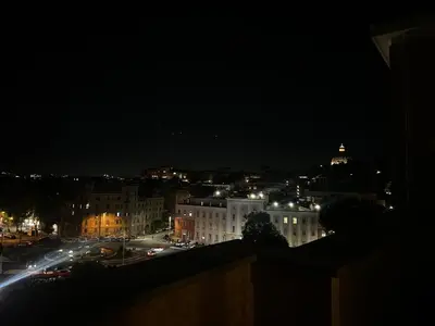 a view of a city at night with lights at F R Vatican view apartment in Rome