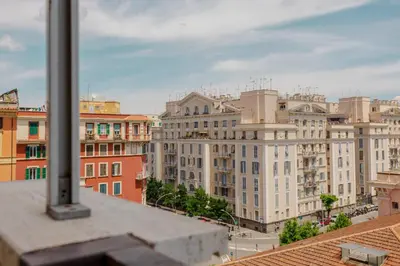a view of a city from the roof of a building at GuestHost - Re di Roma - Bright Apartment X4 in Rome