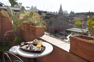 a tray of food on a table on a balcony at Laurina F1 Studio with Panoramic Terrace - LOCAPPART in Rome