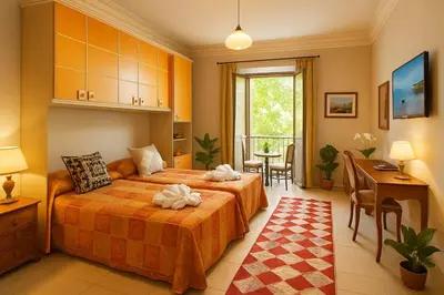 a bedroom with two beds and a table and chairs at RELAX Palace in Rome
