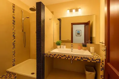 a bathroom with a sink and a shower and a tub at RELAX Palace in Rome