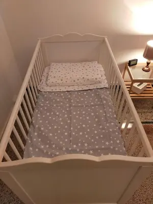 a white crib with a mattress in a room at Attico Luminoso Bed in Bormida in Rome