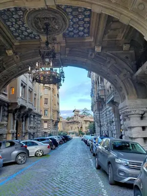 an archway with cars parked on a city street at Attico Luminoso Bed in Bormida in Rome