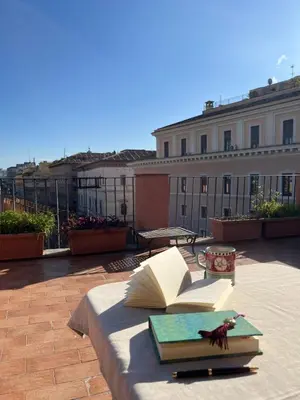 a table with an open book on top of a building at Vatican Rooftop Studio - NEW OPENING in Rome