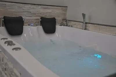 two chairs sitting in a bath tub with water at Imperial Relais in Rome