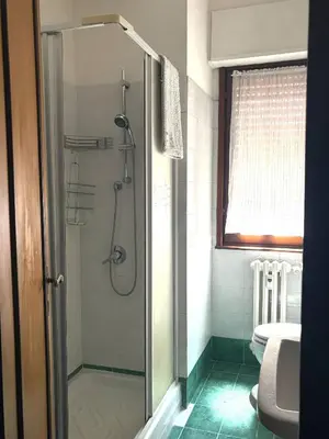 a shower with a glass door in a bathroom at Casa Rita 15 minuti dal centro in Rome