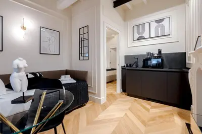 a living room with a couch and a table at Acque Romane Maison Trevi Crociferi in Rome