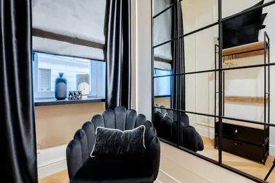 a room with a row of chairs in front of a window at Acque Romane Maison Trevi Crociferi in Rome