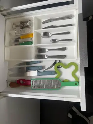 a refrigerator filled with lots of different types of tools at Appartamento Boho a San Lorenzo ,quartiere della street art in Rome