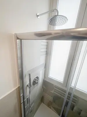 a bedroom with a bed with a flat screen tv on the wall at RM555 Elegant apartment in Rome