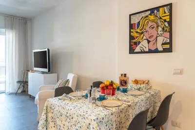 a dining room with a table with food on it at Trastevere Station Apartment View in Rome