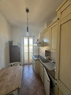 a kitchen with a wooden table and a wooden counter top at Belvedere home in Rome
