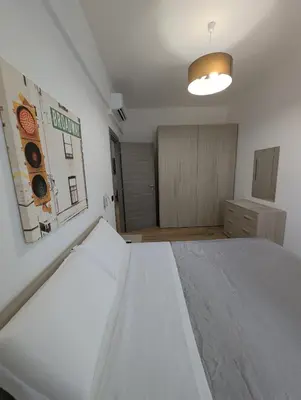 a bedroom with a large white bed in it at Maison Simone Marconi in Rome