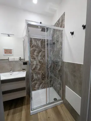a bathroom with a shower and a sink at Maison Maurizio Marconi in Rome