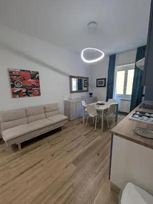 a living room with a couch and a table at Maison Maurizio Marconi in Rome