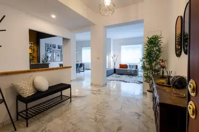 a living room with a couch and a table at Maia - Luxury Apartment in Monteverde in Rome