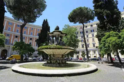a fountain in the middle of a city at Royal Blue - Holiday Apartment in Rome