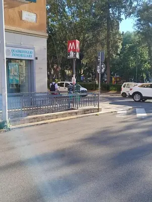 a mcdonalds restaurant with cars parked in a parking lot at Alcinque - Casa vacanze in Rome