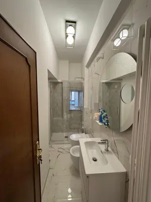 a bathroom with a sink and a toilet and a mirror at Suite 41 in Rome