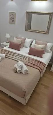 two large beds with towels on them in a bedroom at Sweet Saint Paul in Rome