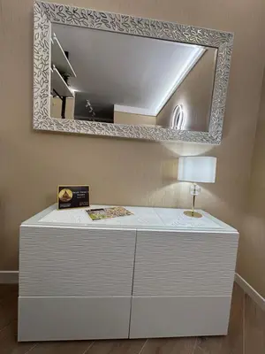 a white dresser with a mirror and a lamp at Saint Peter's Sunset View Luxury Apartment in Rome