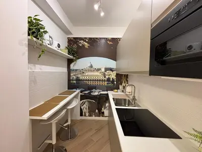 a kitchen with a view of a building at Saint Peter's Sunset View Luxury Apartment in Rome