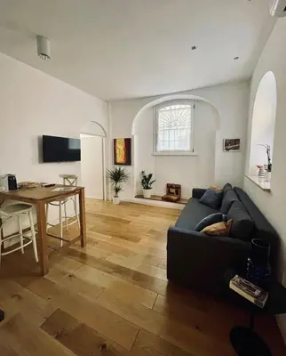 a living room with a couch and a table at Domus 31 - Colosseum in Rome