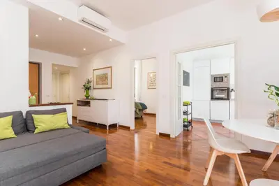 a living room with a couch and a table at Line 8 House in Rome