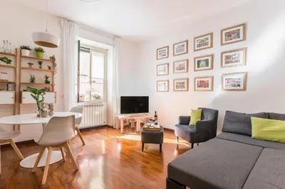 a living room with a couch and a table at Line 8 House in Rome