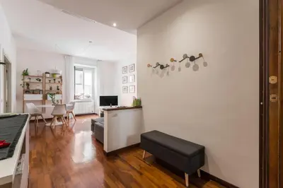 a living room with a couch and a table at Line 8 House in Rome