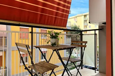 a balcony with a table and two chairs on a balcony at Roma Passion Suite in Rome