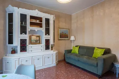 a living room with a couch and a hutch at GuestHost - La Rosa di Trastevere in Rome