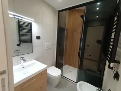 a bathroom with a toilet and a sink and a shower at World Wide Bed Termini in Rome