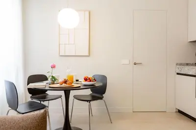 a dining room with a table and chairs at Interno2 - Cozy flat near Vatican Museums in Rome