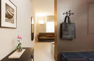 a living room with a couch and a table at Interno2 - Cozy flat near Vatican Museums in Rome
