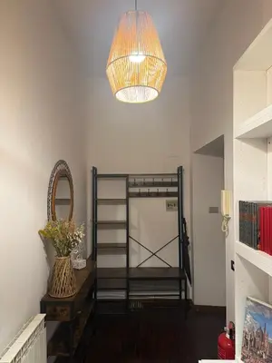 a room with a bunk bed and a chandelier at Borgo Una Casa Nel Vicolo in Rome