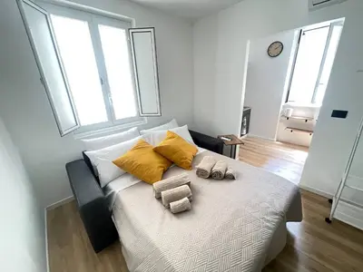 a bedroom with a bed with two towels on it at Basilica San Giovanni Appia Antica At a Friends House in Rome