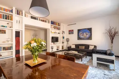 a living room with a couch and a table at Bright and spacious flat in the hearth of Rome in Rome