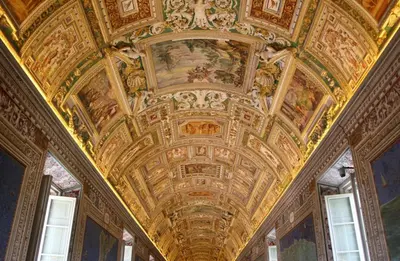 a room with a ceiling with paintings on it at Rome Centre - Spacious Apartment - Jacuzzi - AC - WiFi in Rome