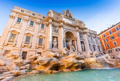 a building with a fountain in front of a building at Rome Centre - Spacious Apartment - Jacuzzi - AC - WiFi in Rome